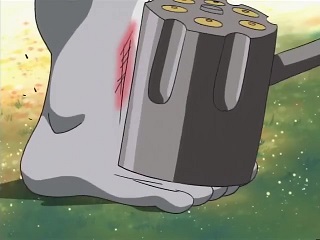 Pinocchimon's hammer strikes MetalEtemon's shin, leaving behind a red mark.